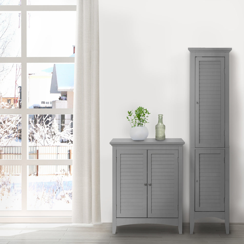 Two Teamson Home Glancy Wooden Linen Tower Cabinets with Storage in front of a window, offering organization and storage.