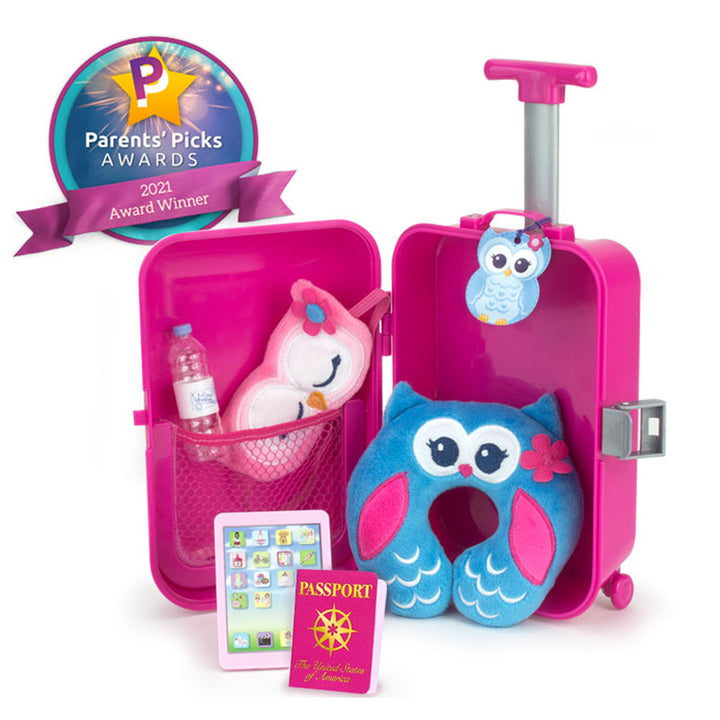 This 18" doll travel accessory set includesa pink hardside suitcase, owl sleep mask and travel pillow, owl luggage tag, bottle of water, passport, and a mobile tablet.