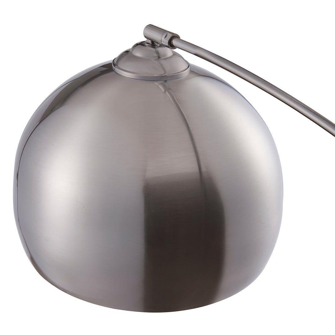A Teamson Home Arquer Arc 68" Metal Floor Lamp with Bell Shade, Polished Nickel with a metal ball on it, perfect to illuminate a reading nook or office with soft light.