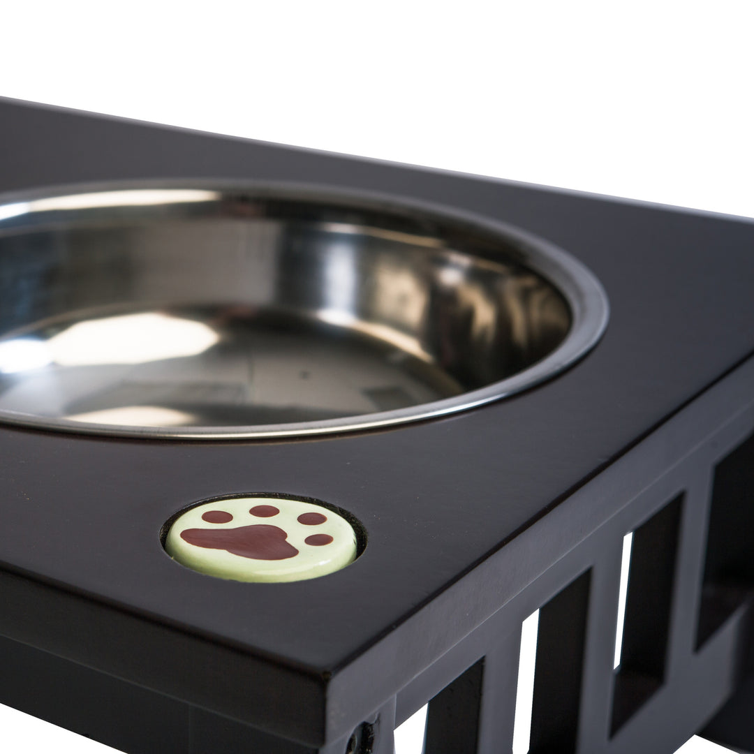 A close-up of the raised pet feeder and the stainless steel bowls.