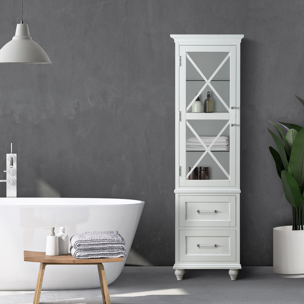 A modern bathroom with a freestanding tub, a Teamson Home Blue Ridge Wooden Linen Tower Cabinet with Adjustable Shelves in white, and a plant in the corner.