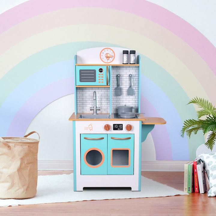 Children's Teamson Kids Little Chef Santos Retro Wooden Kitchen Playset, made of MDF, in a room with a pastel rainbow wall mural.