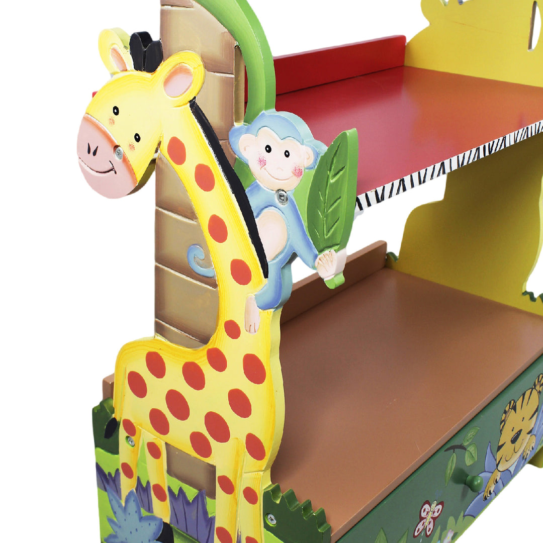 A Fantasy Fields Kids Painted Wooden Sunny Safari Bookshelf with Storage Drawer, Multicolor with a giraffe and a monkey.