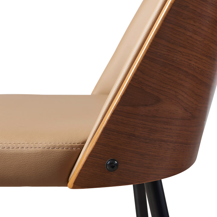 A close-up of the seat structure of the Teamson Home Layton Khaki Faux Leather Dining Chair with Black Tapered Legs