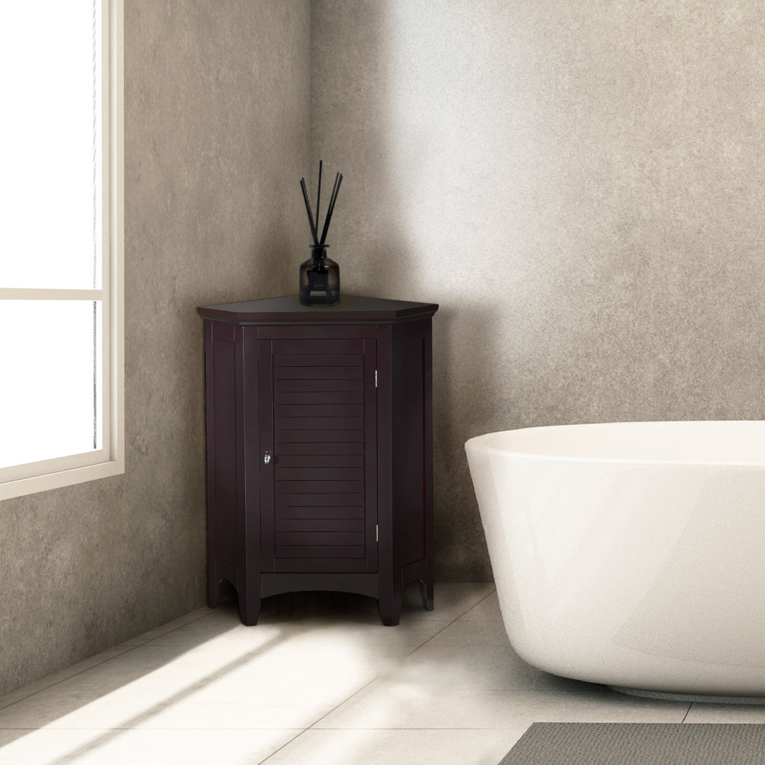 Modern bathroom with a freestanding bathtub and a Dark Brown Glancy Corner Floor Cabinet with a louvered door and a chrome knoband an aroma diffuser.