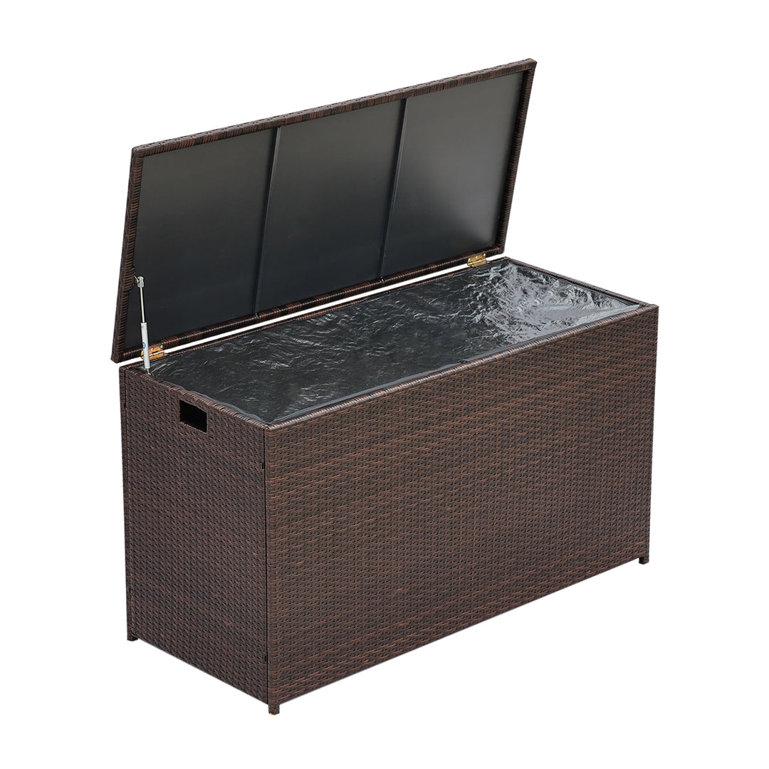 Teamson Home Brown PE Rattan 154-Gallon Outdoor Deck Box open with a view of the lining