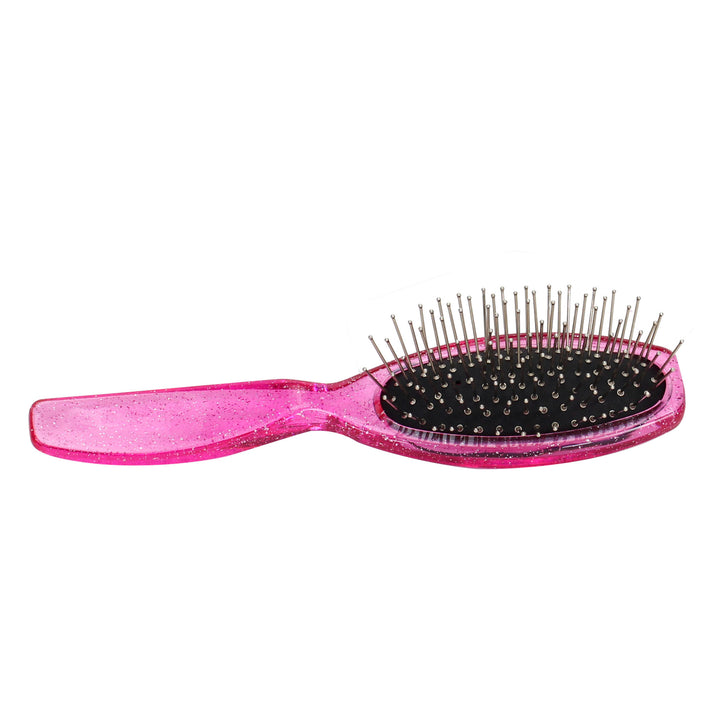 A close-up of the pink hair brush.