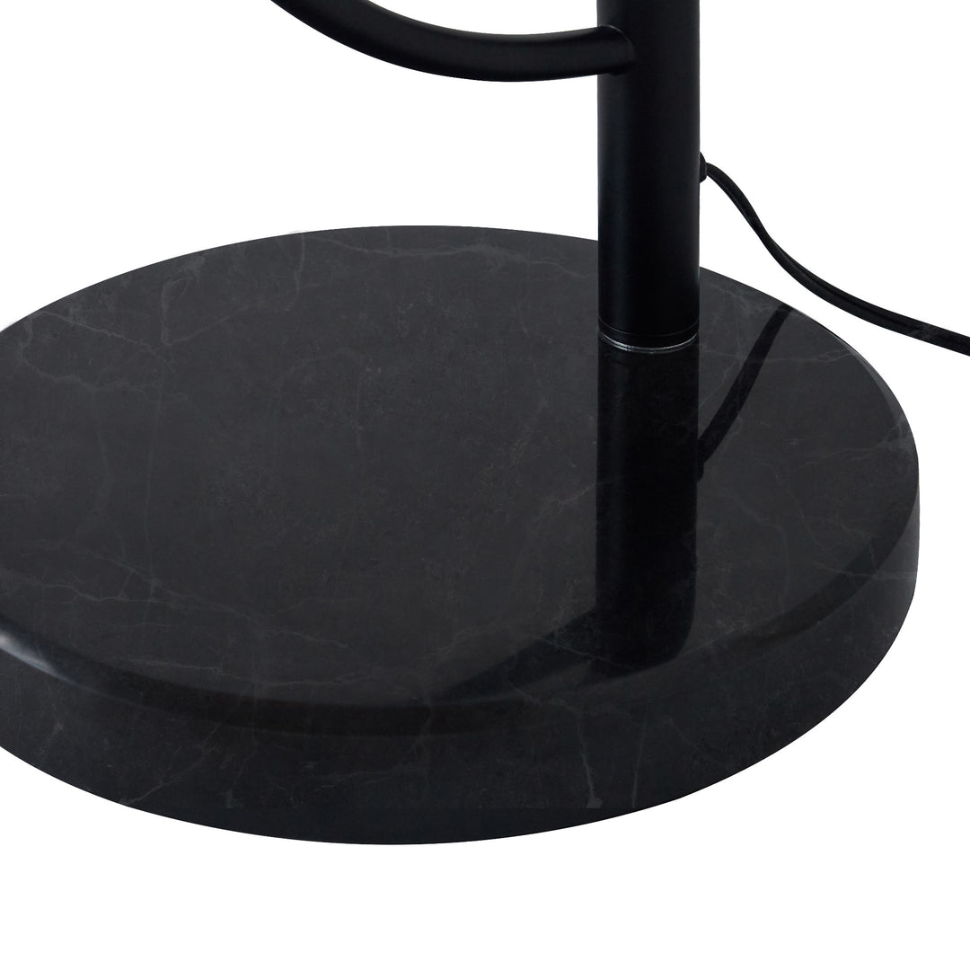 Close-up of the black faux marble base of the Teamson Home Danna Floor Lamp with Marble Base and Built-In Table, Black