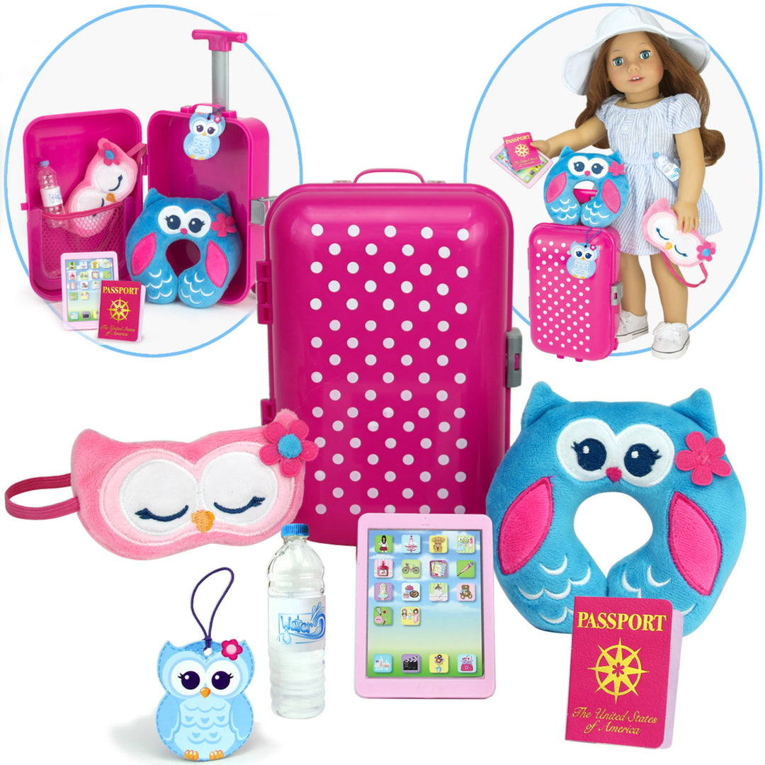 18" Doll travel pack: a pink hardside suitcase, owl sleep mask and travel pillow, owl luggage tag, bottle of water, passport, and a mobile tablet.