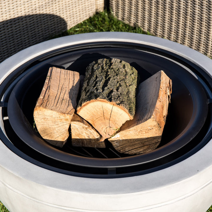 Teamson Home 30" Wood Burning Fire Pit with Faux Concrete Base in Gray with logs places in the fire bowl