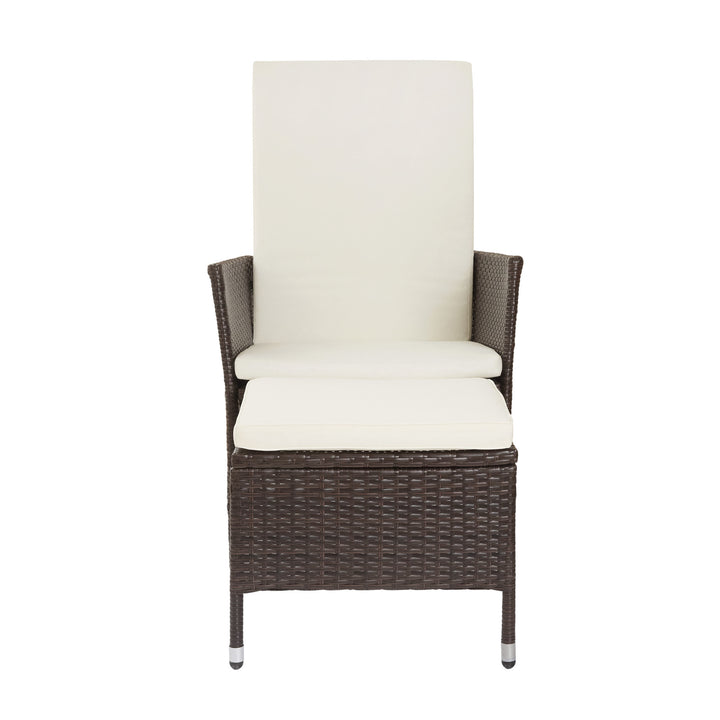 A Teamson Home Outdoor PE Rattan Patio Chair with Ottoman extended, with white cushions