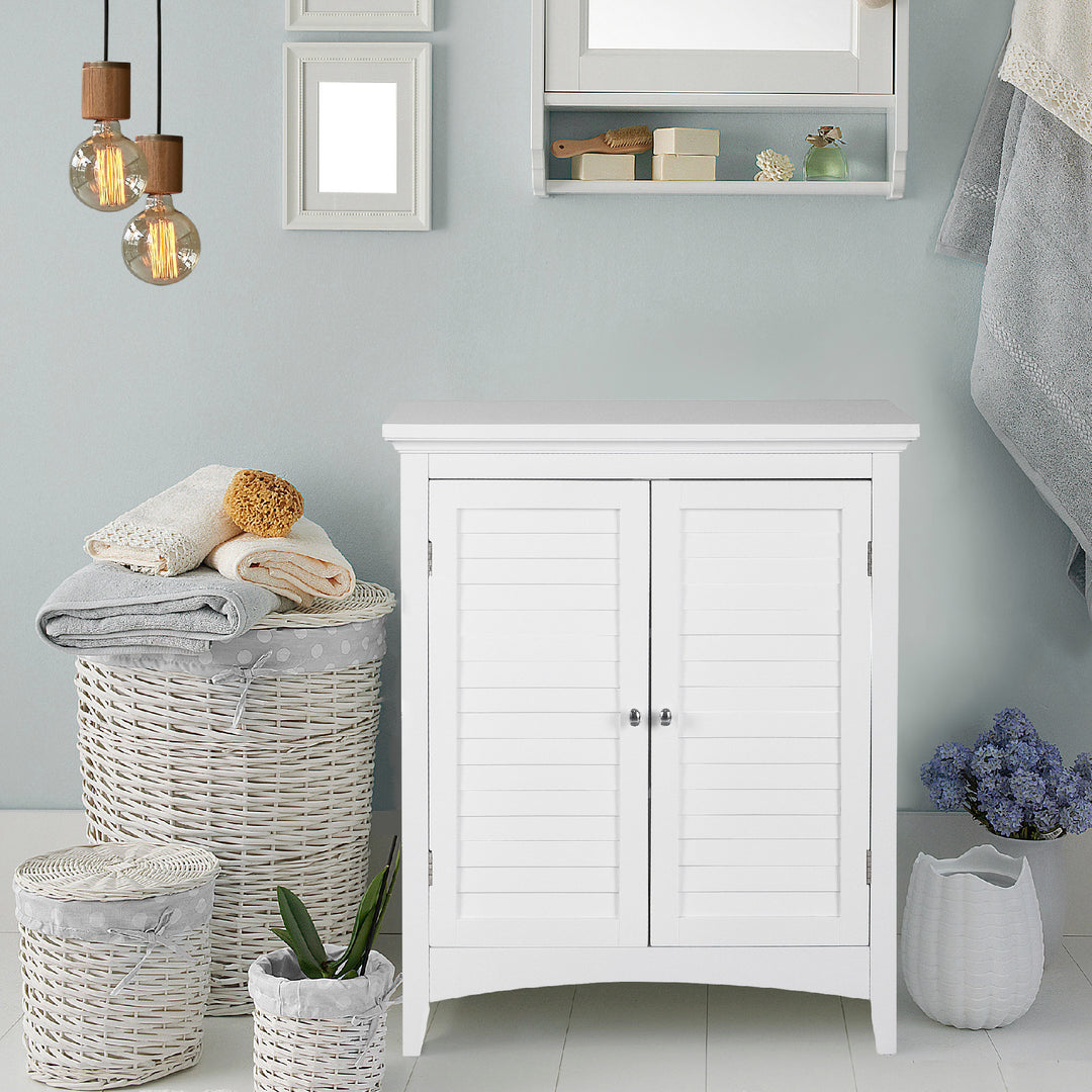 White Glancy 2-Door Floor Cabinet with Louvered Doors, Chrome Knobsin a tranquil blue bathroom setting.
