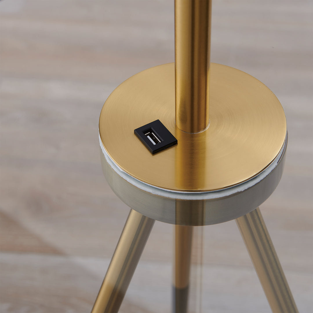 A close-up of a USB port on a Teamson Home Myra Floor Lamp with Table, Gold/White Shade