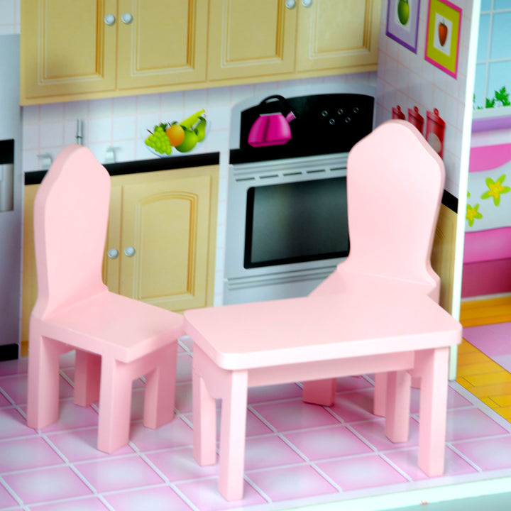 A table and two high-back chairs in a kitchen, pink.