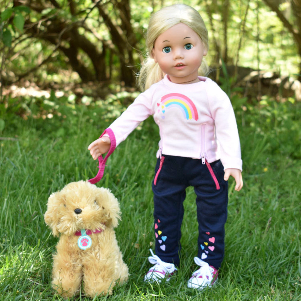 An 18" blonde doll with a pink leash on her puppy doll.