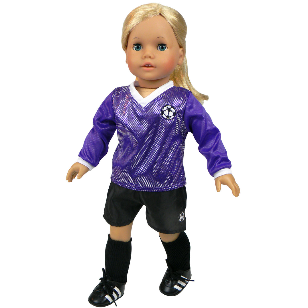 A blonde 18" doll with blue eyes dressed in a purple soccer jersey, black shorts, black socks, and black cleats .