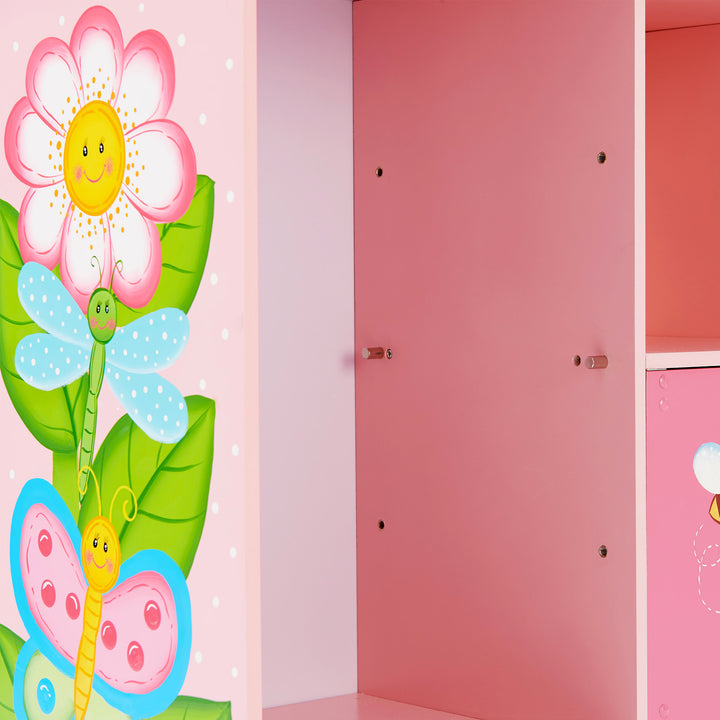 Close-up of the adjustable shelving peg locations on the pink storage cubicle and the illustrations on the side.