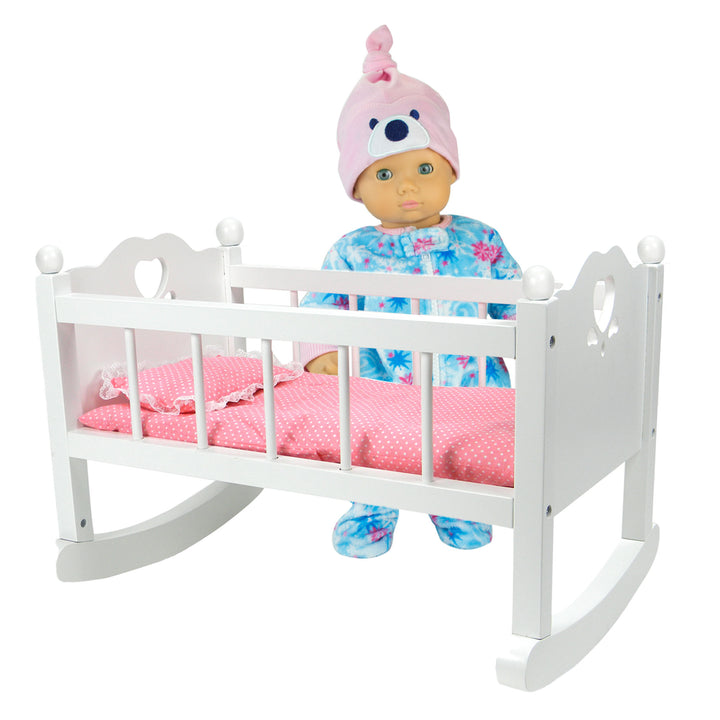A doll standing next to a White Baby Doll Cradle Furniture Set for 15" Dolls with a rocking design.