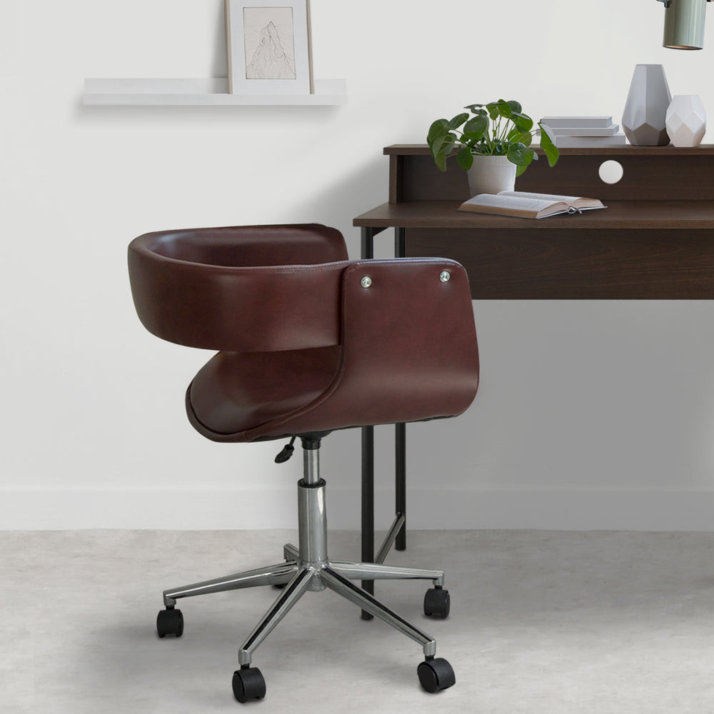 Teamson Home's Faux Brown Leather Mid-Century Modern Adjustable Office Chair next to a walnut finished writing desk.