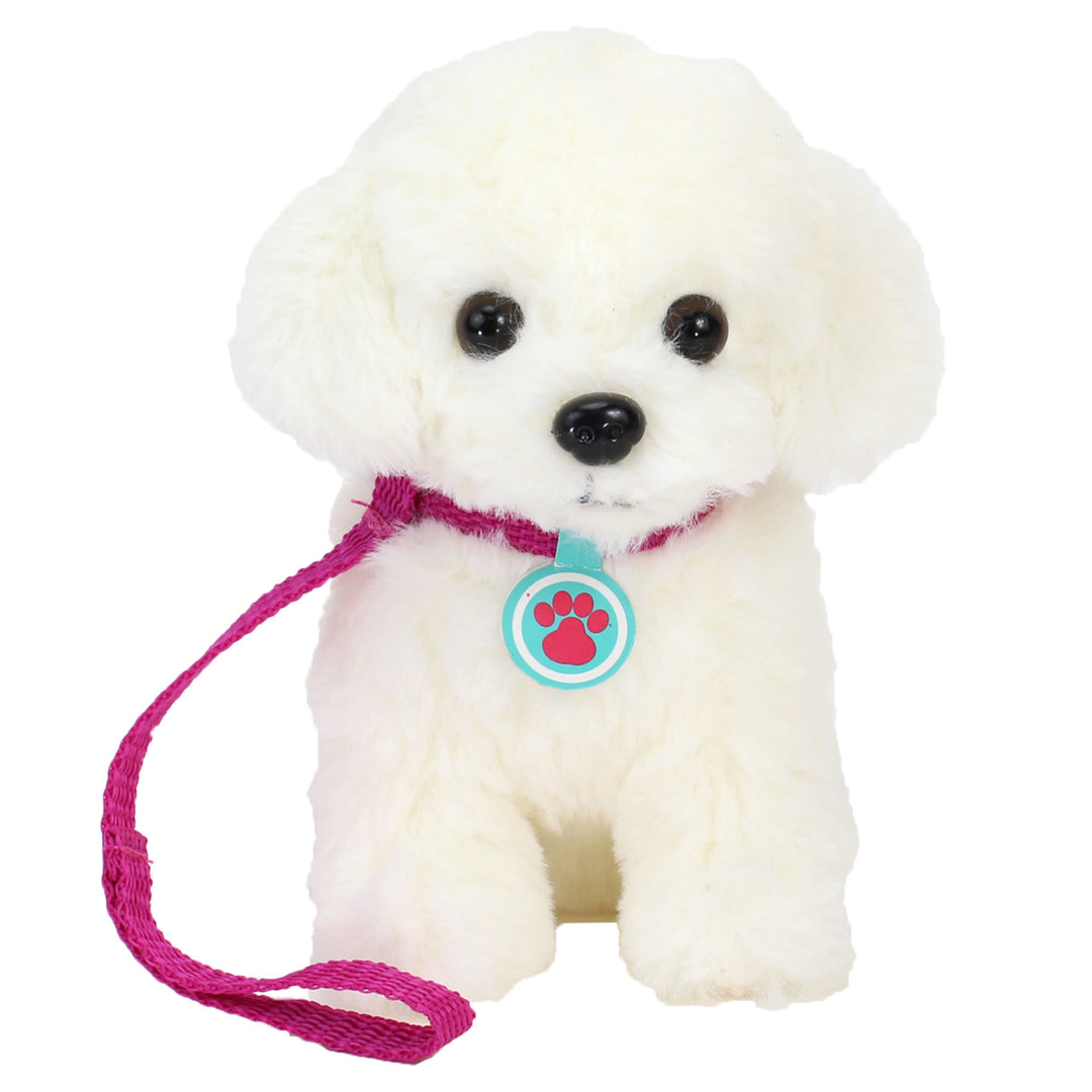 A white fluffy stuffed puppy with a pink leash and blue tag around its neck.