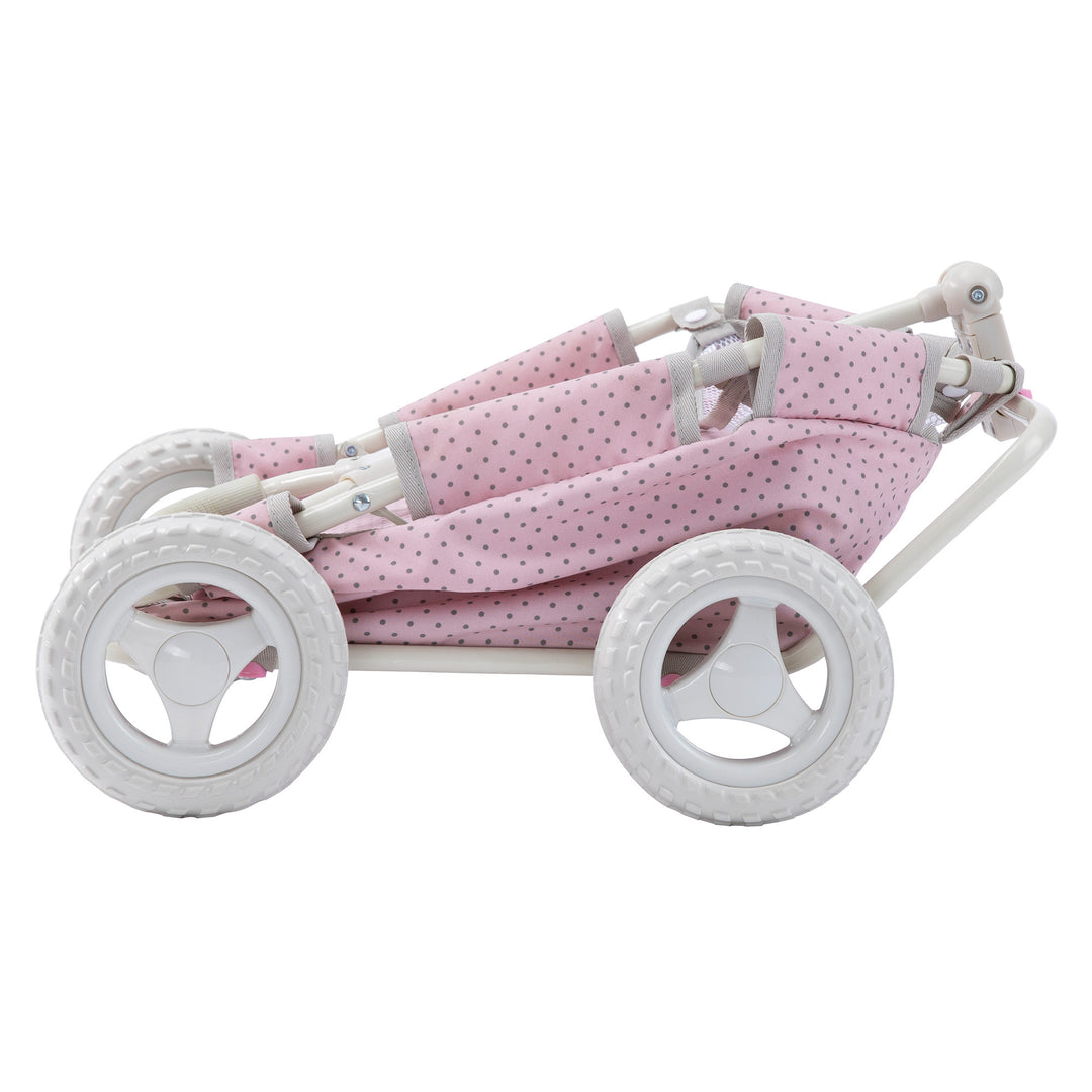 A pink and white Olivia's Little World Polka Dots Princess Baby Doll Wagon in its collapsed position.