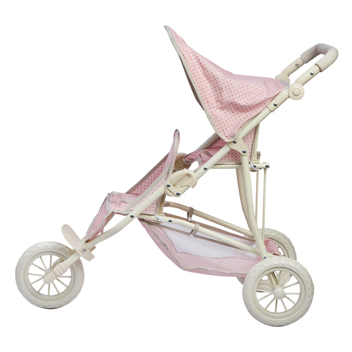 A side view of the pink with gray polka dots baby doll tandem jogging stroller.