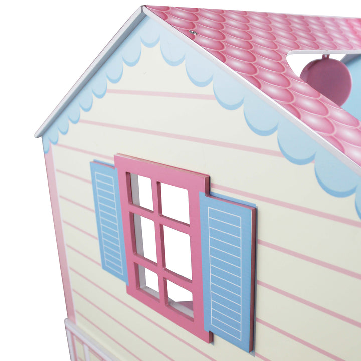 A close up of the detailed illustrations - blue and pink shingled, blue and pink window.