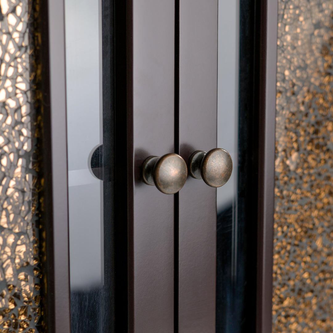 Close-up of the antique brass finished round knobs