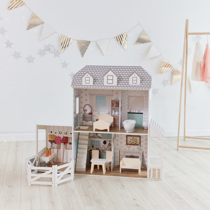 A Teamson Kids Dreamland Farm Dollhouse with 14 Accessories, White/Gray in a room, boasting kid-sized dimensions.