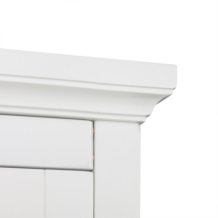 Detail of Teamson Home St. James Wooden Linen Tower Cabinet with 2 Drawers, White corner showing joints and molding.