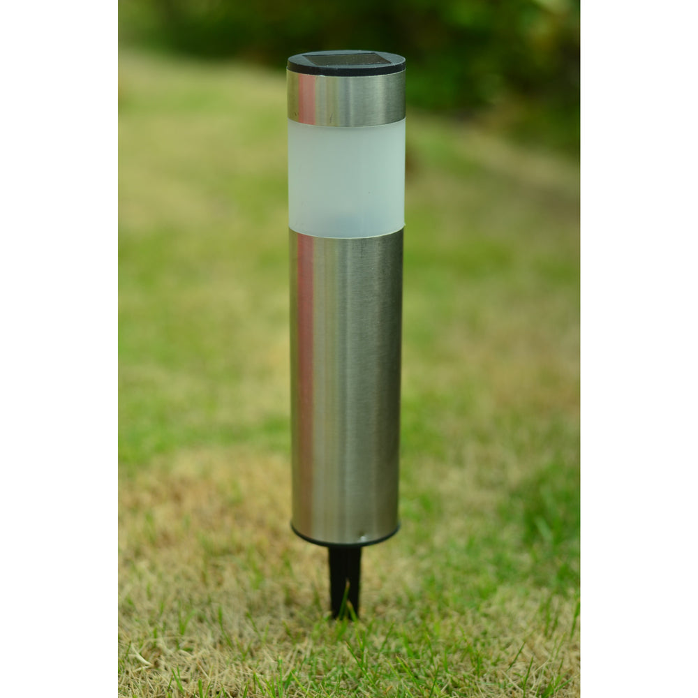 Stainless steel Teamson Home Outdoor Solar Lights, Set of 4 with a frosted glass diffuser on a grass lawn.