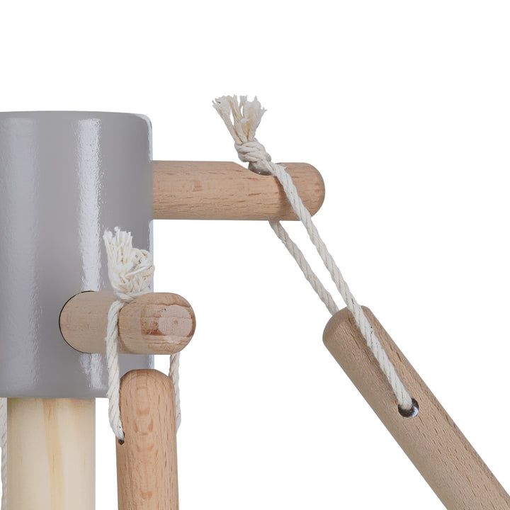 Close up of the wodden structure that holds the accessories of the Teamson Kids 6 Piece Little Helper Cleaning Set. 