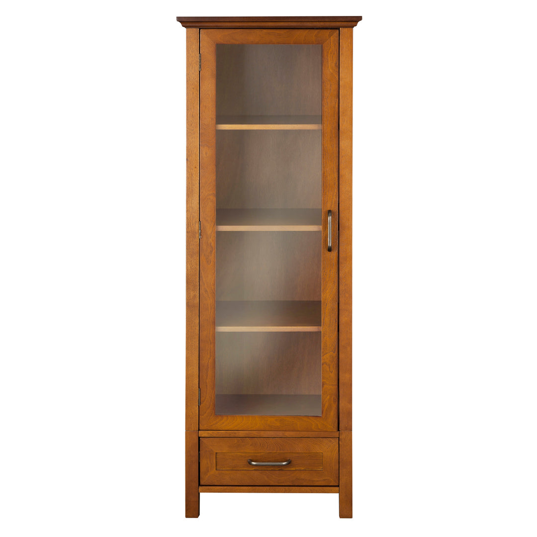 Teamson Home Avery Wooden Linen Tower Cabinet with Storage, Oiled Oak with a glass door and a lower drawer.