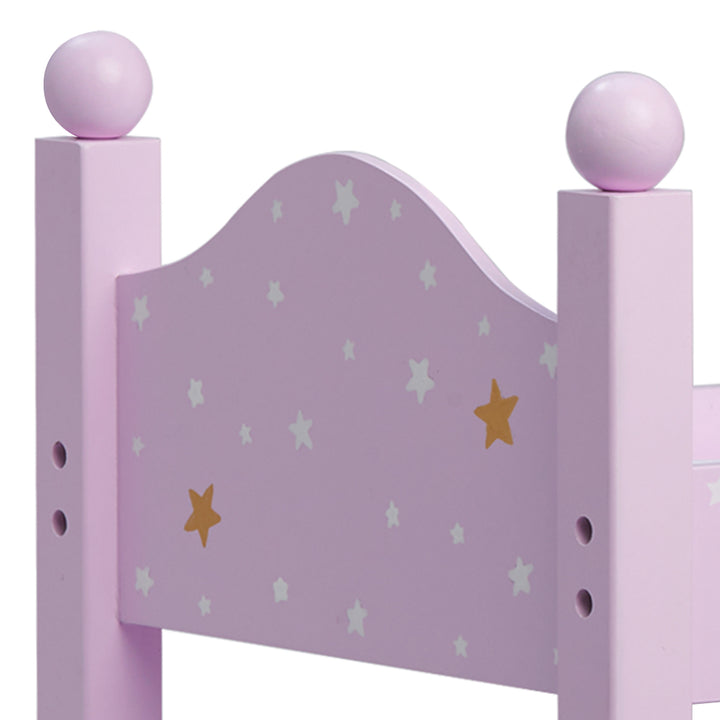 Close-up of the pink head board with white and gold stars.