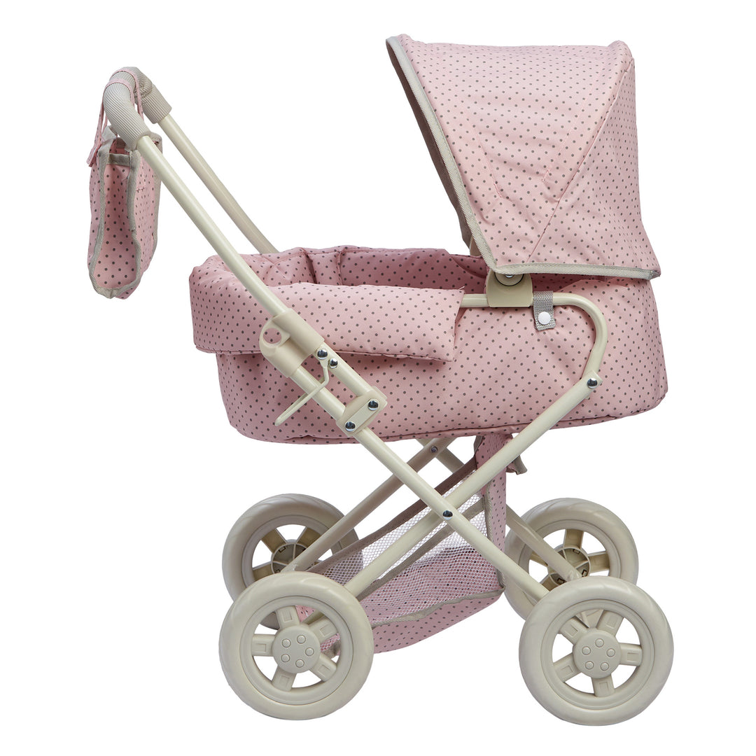 A side view of the Olivia's Little World Polka Dots Princess Deluxe Baby Doll Stroller, Pink with polka dots.