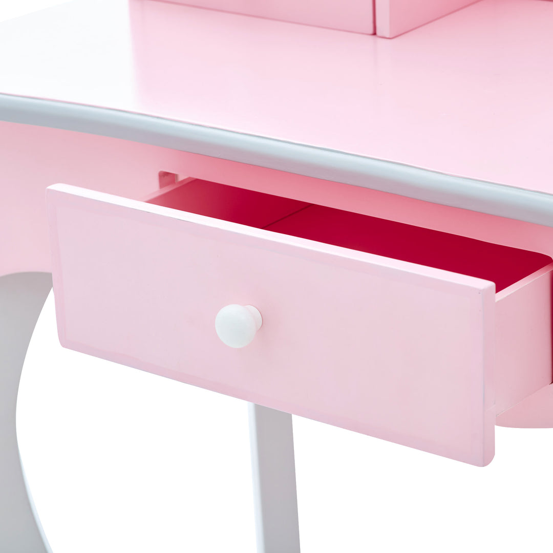 A pink and gray vanity table with an open storage drawer