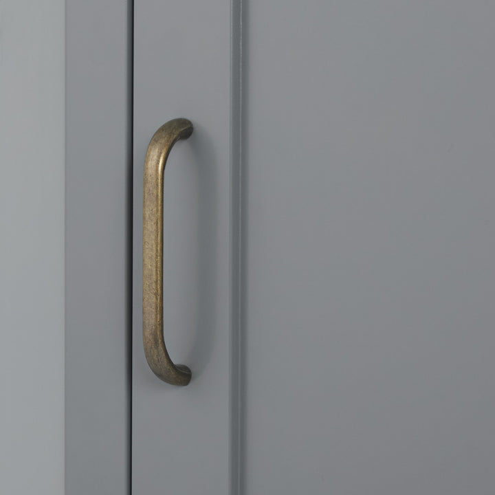 Close-up of the brass pull handle on the gray Mercer Corner Floor Cabinet