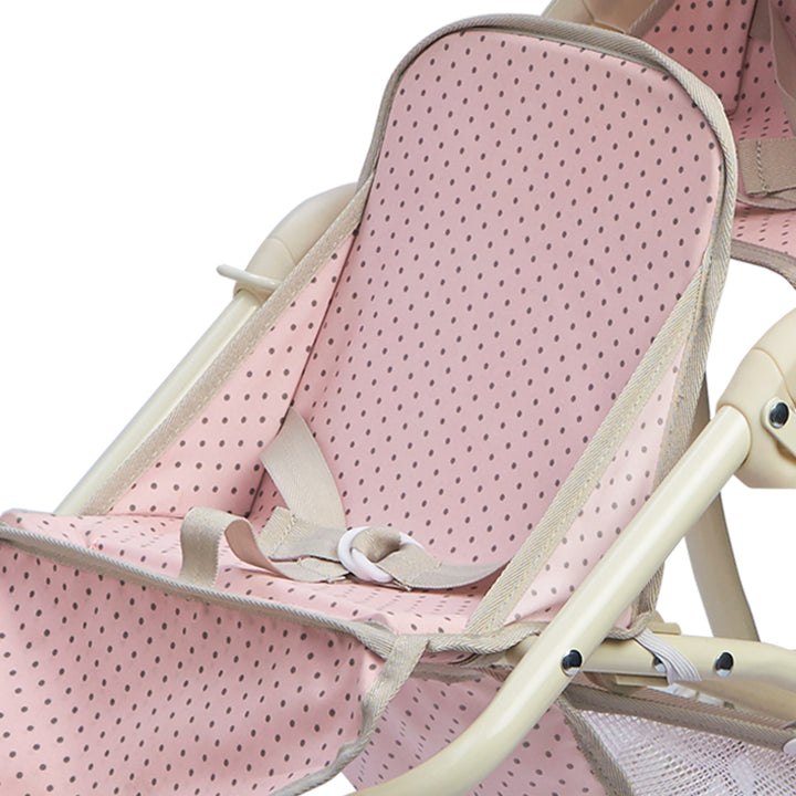 Close-up of one of the seats with the seat belt fastened of the baby doll tandem jogging stroller, pink with gray polka dots.