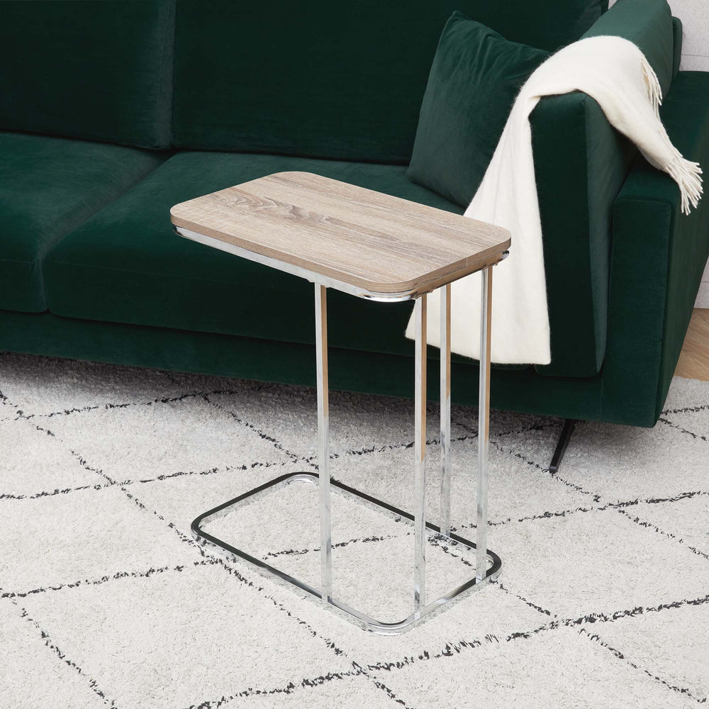 Teamson Home Cora C-shaped table with Salt Oak table top and metal base next to a green sofa