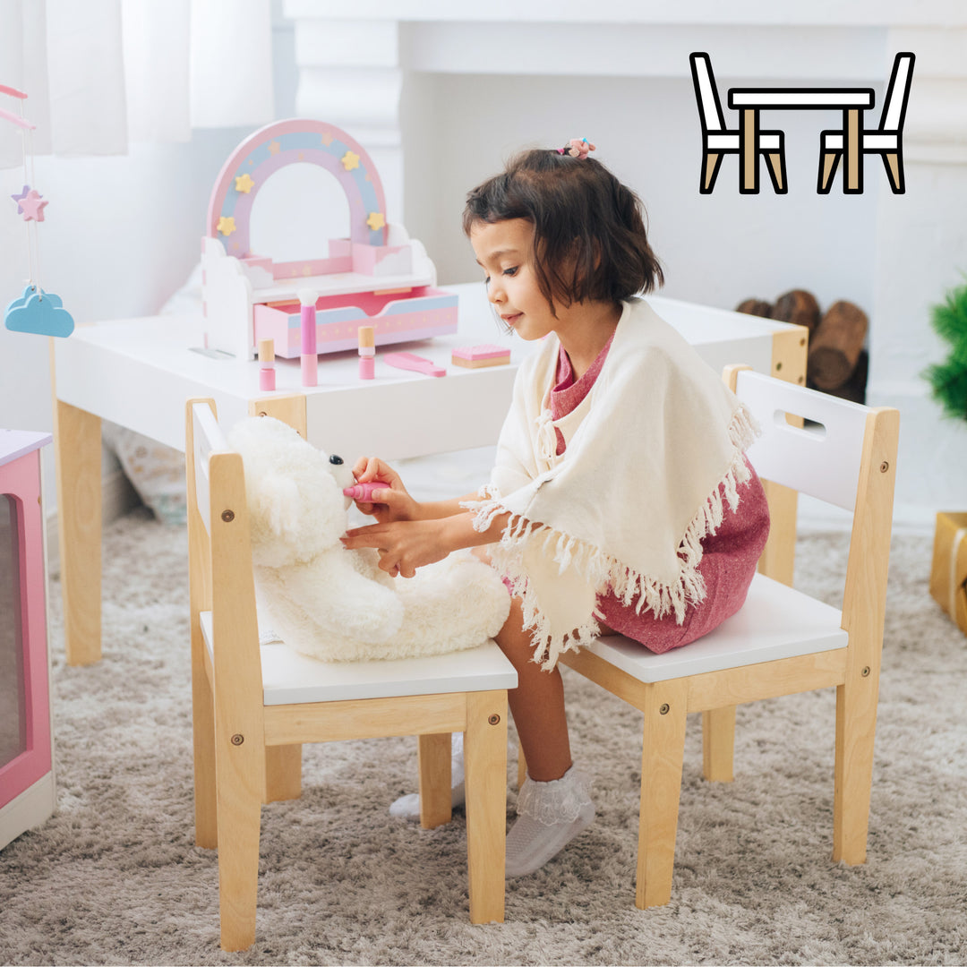 A little girl sitting on a child's size chair across from  a teddy bear in a playroom.