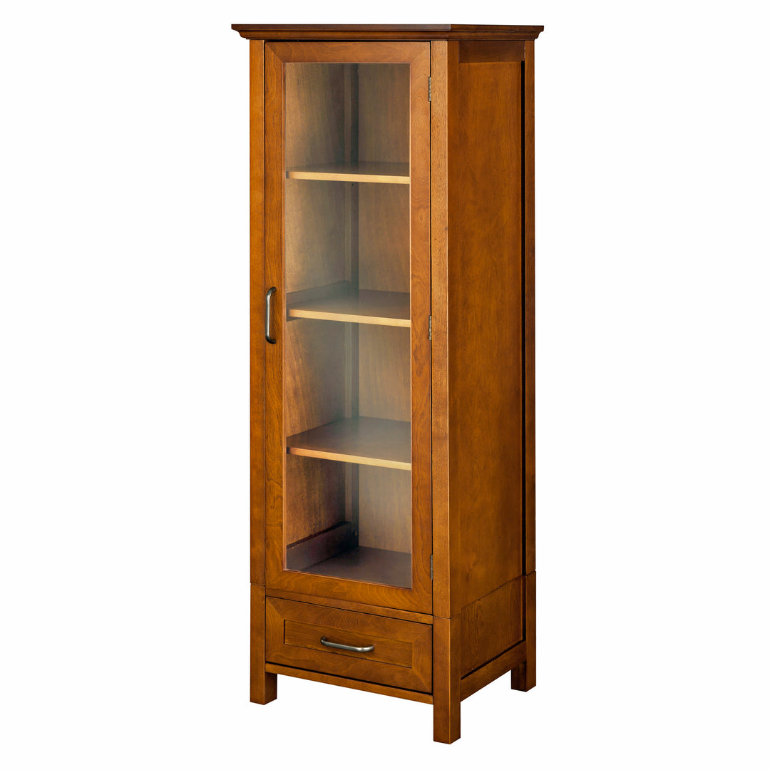 A high-quality Teamson Home Avery Wooden Linen Tower Cabinet with Storage, Oiled Oak with glass door and a drawer.