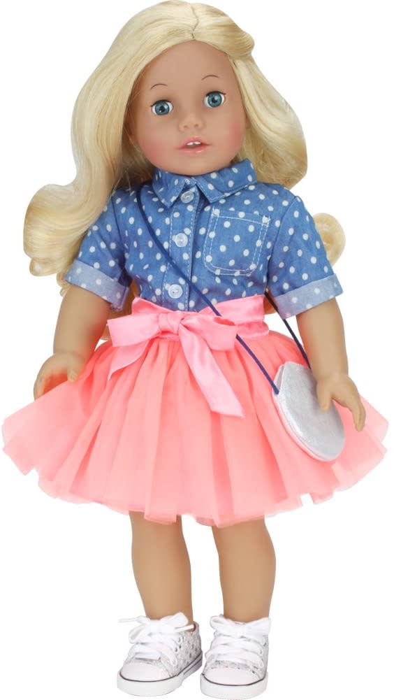 A blonde 18" doll standing in a denim shirt, peach tutu and a pair of silver sequin sneakers.