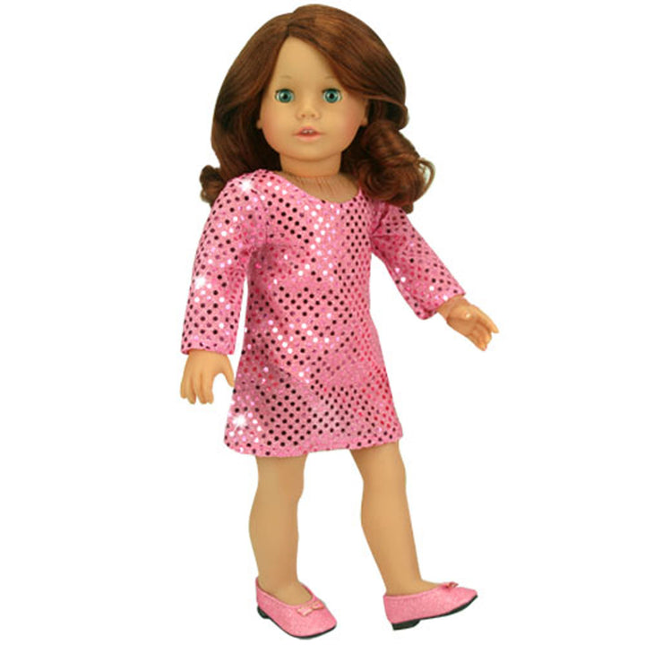 An 18" doll with auburn hair in a pink sparkly dress with pink sparkly dress shoes.
