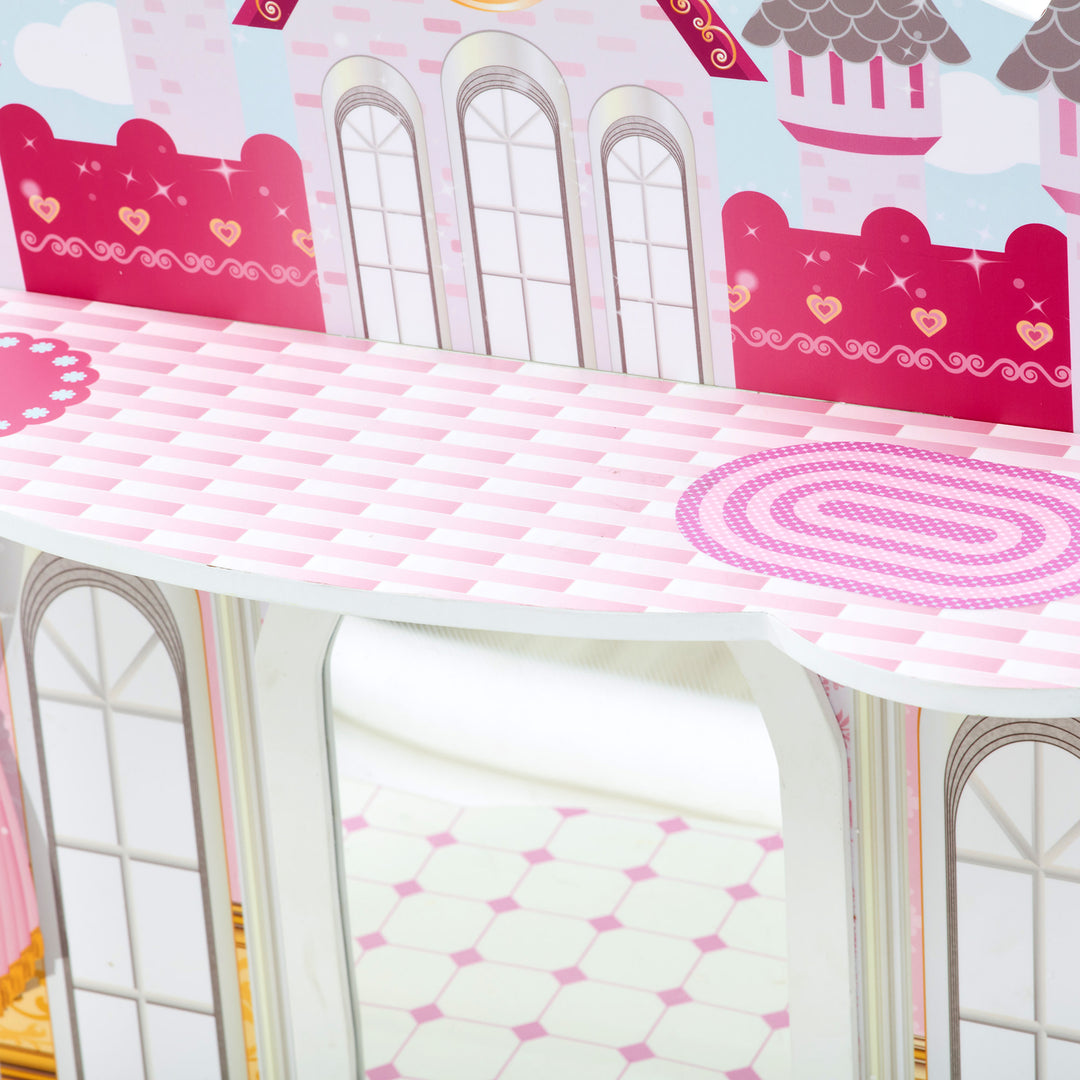 A pink and white Fantasy Fields Kids Dreamland Castle Vanity Set with Chair and Accessories dollhouse with a mirror on top.