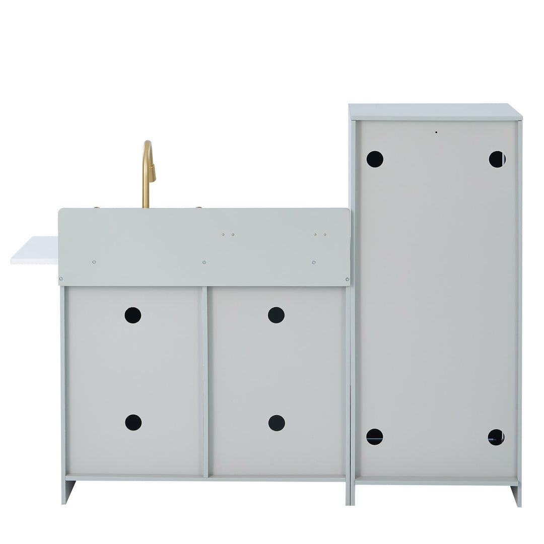 Modern white Teamson Kids Little Chef Charlotte play kitchen storage furniture with black dot details and a small golden knob.