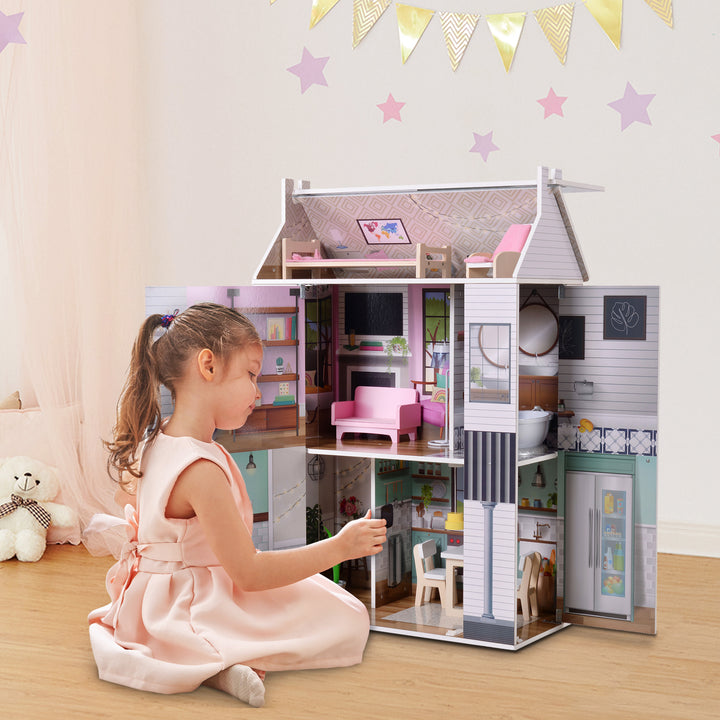 A little girl in a blush-color dress arranging pieces inside the dollhouse.