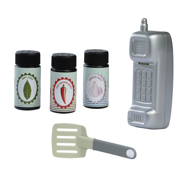Image of accessories, three condiment containers for Bay leaves, hot pepper seeds, and onion salt. Also shows a silver phone and a grey spatula. 