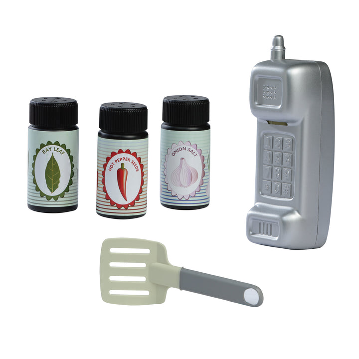 Image of accessories, three condiment containers for Bay leaves, hot pepper seeds, and onion salt. Also shows a silver phone and a grey spatula.