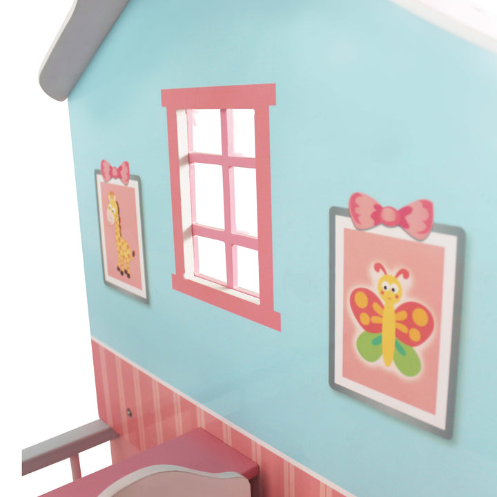 A close-up of detailed illustrations inside, including a pink window and two faux paintings of a giraffe and butterfly.
