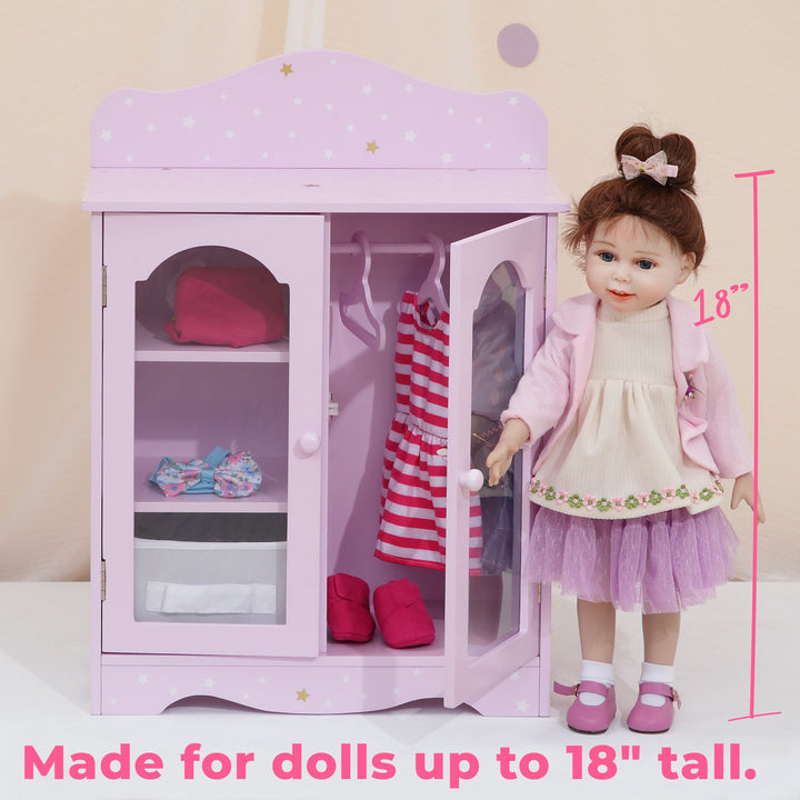 An Olivia's Little World Twinkle Stars Princess Fancy Closet with Hangers for 18" Dolls, Pink is standing in front of a pink dresser.